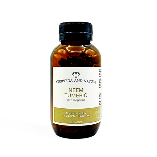Bottle of Neem Turmeric extract from Ayurveda and Nature on a white background